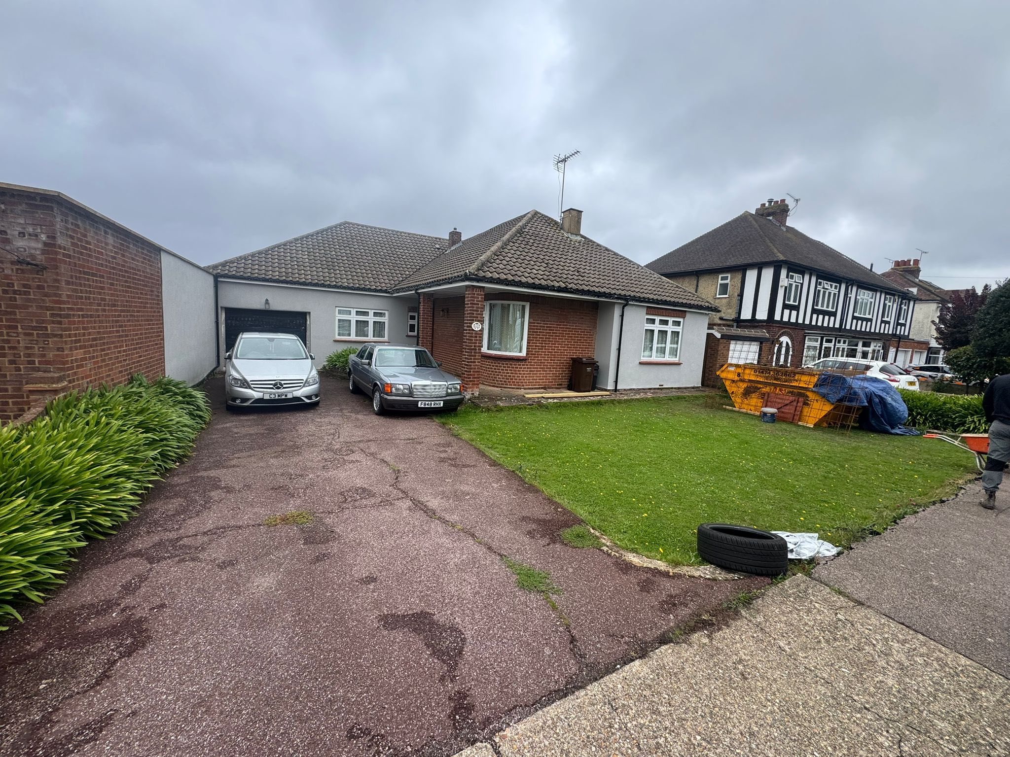 Old worn aggregate driveway before block paving installation in Rochester