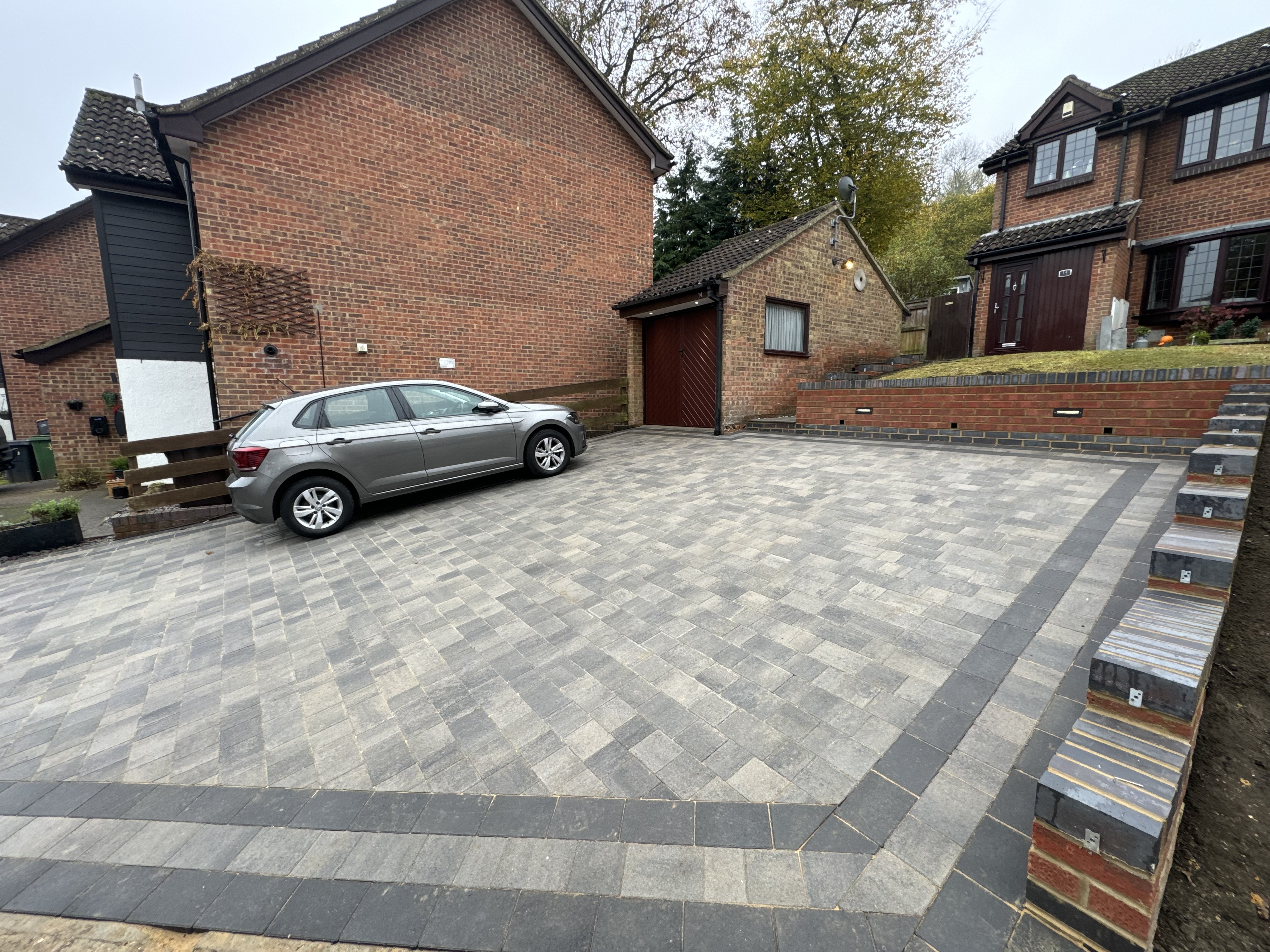 Finished block paving driveway with contrasting border and retaining walls Kent