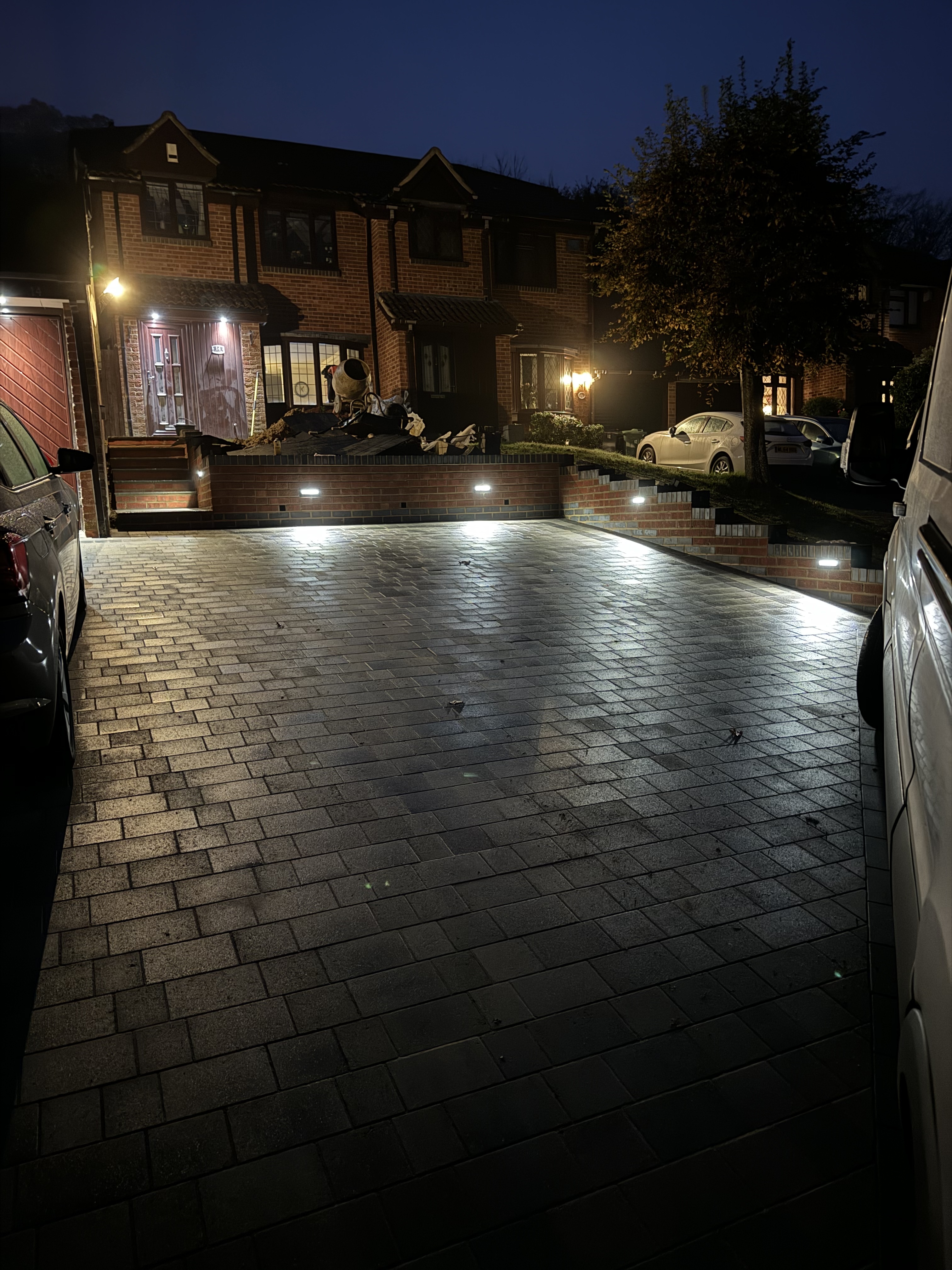 Completed block paving driveway with LED lighting at night Kent