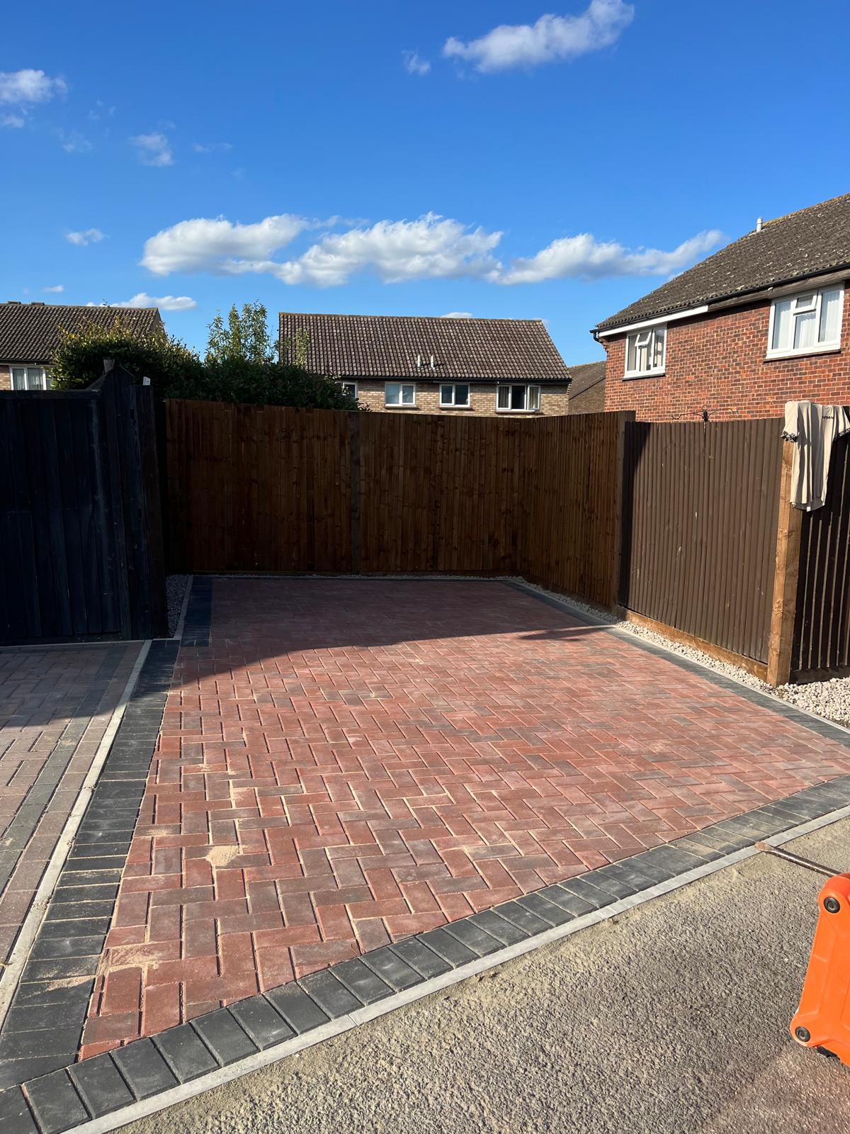 Traditional Red Herringbone Driveway with Contrasting Border