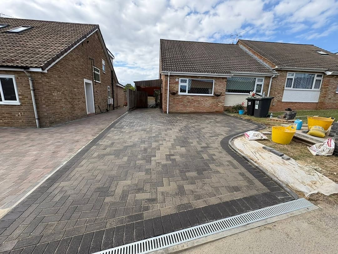 Resin ACO drainage channel along the pavement edge of a Burnt Oak block paving driveway in Burham, Medway