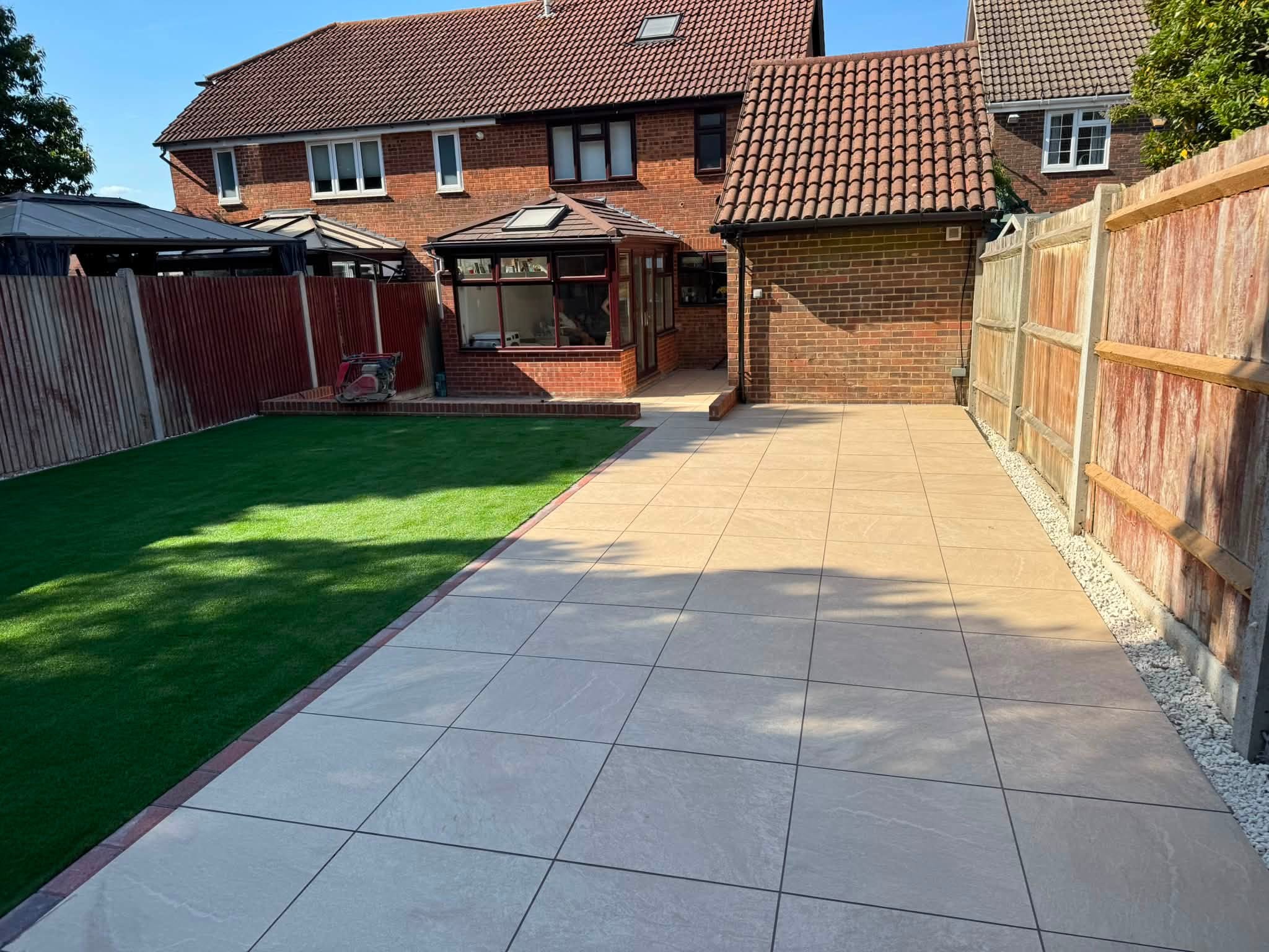 Aura Beige Porcelain Patio, Brick Retaining Walls & Artificial Grass in Hempstead, Gillingham