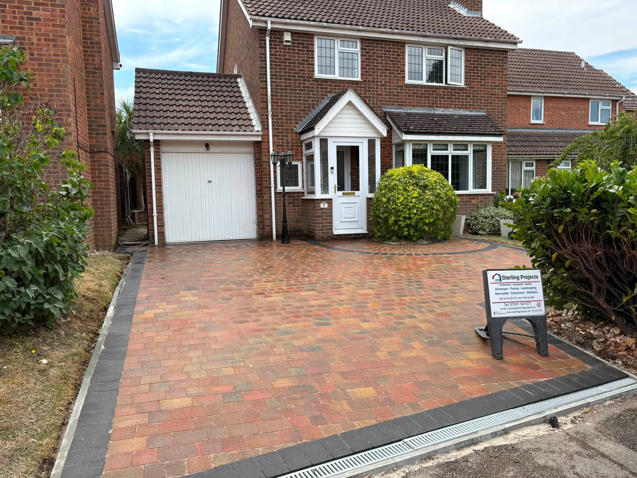 Resin ACO drainage channel across a block paving driveway in Lordswood, Medway