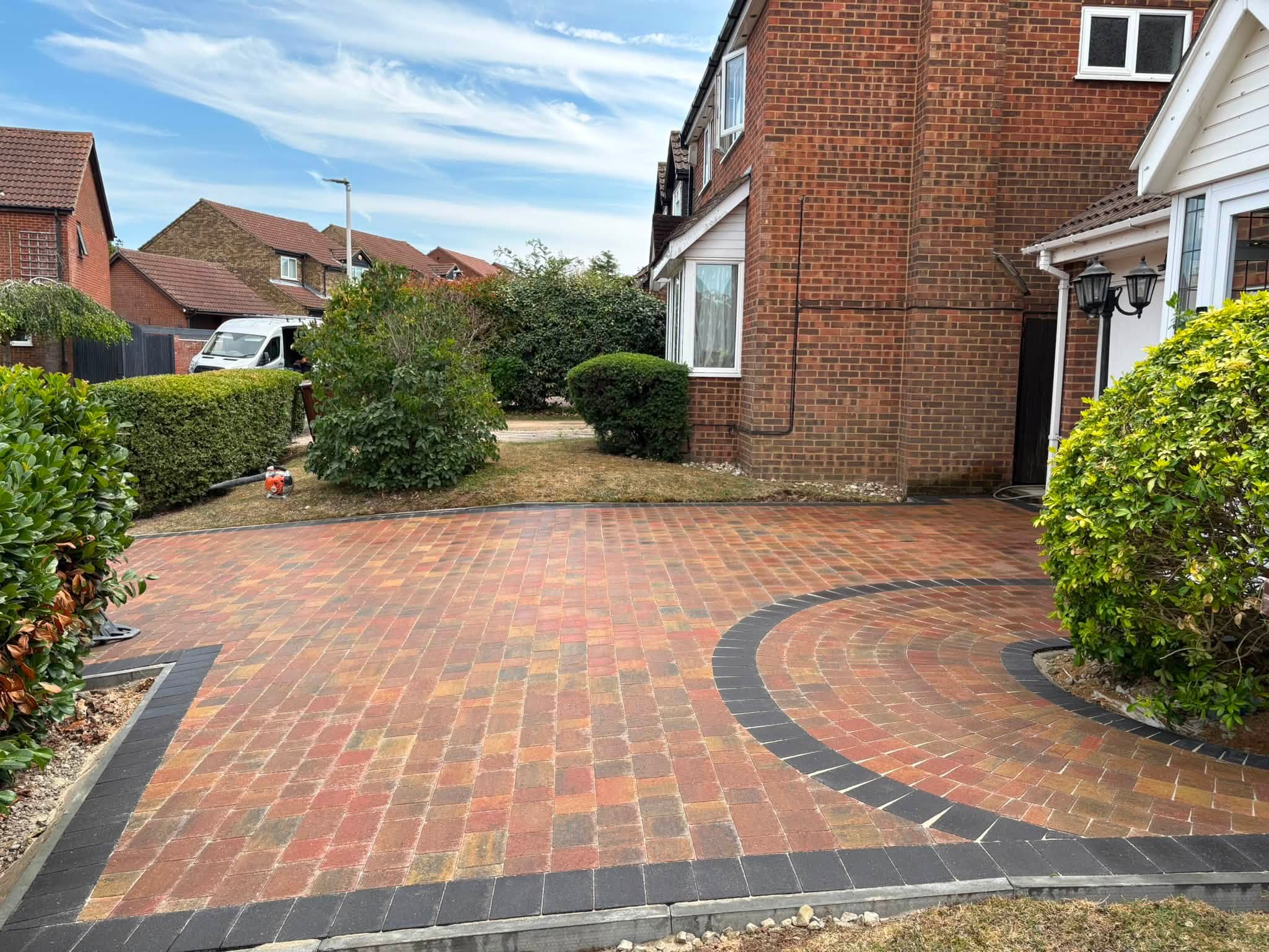 Autumn Gold Beta Trio paving wrapping around retained shrubs at a Lordswood home