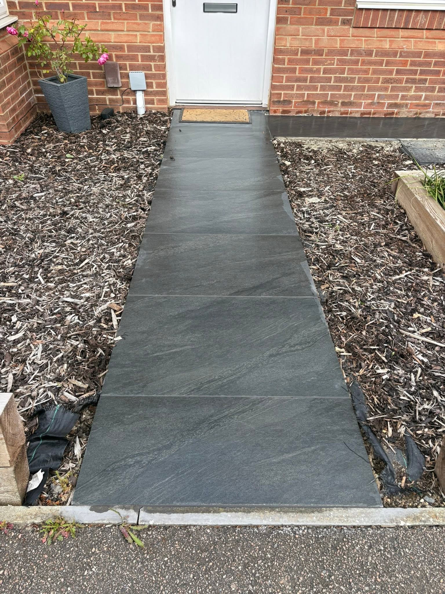 Anthracite porcelain front entrance path leading to the front door of a Maidstone home