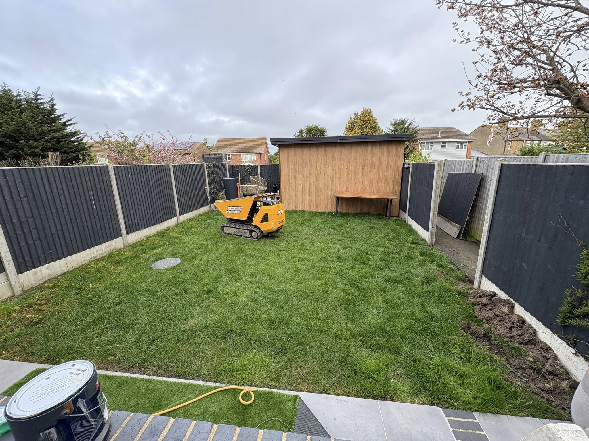 Maidstone rear garden during groundwork with mini dumper before porcelain path and artificial grass installation