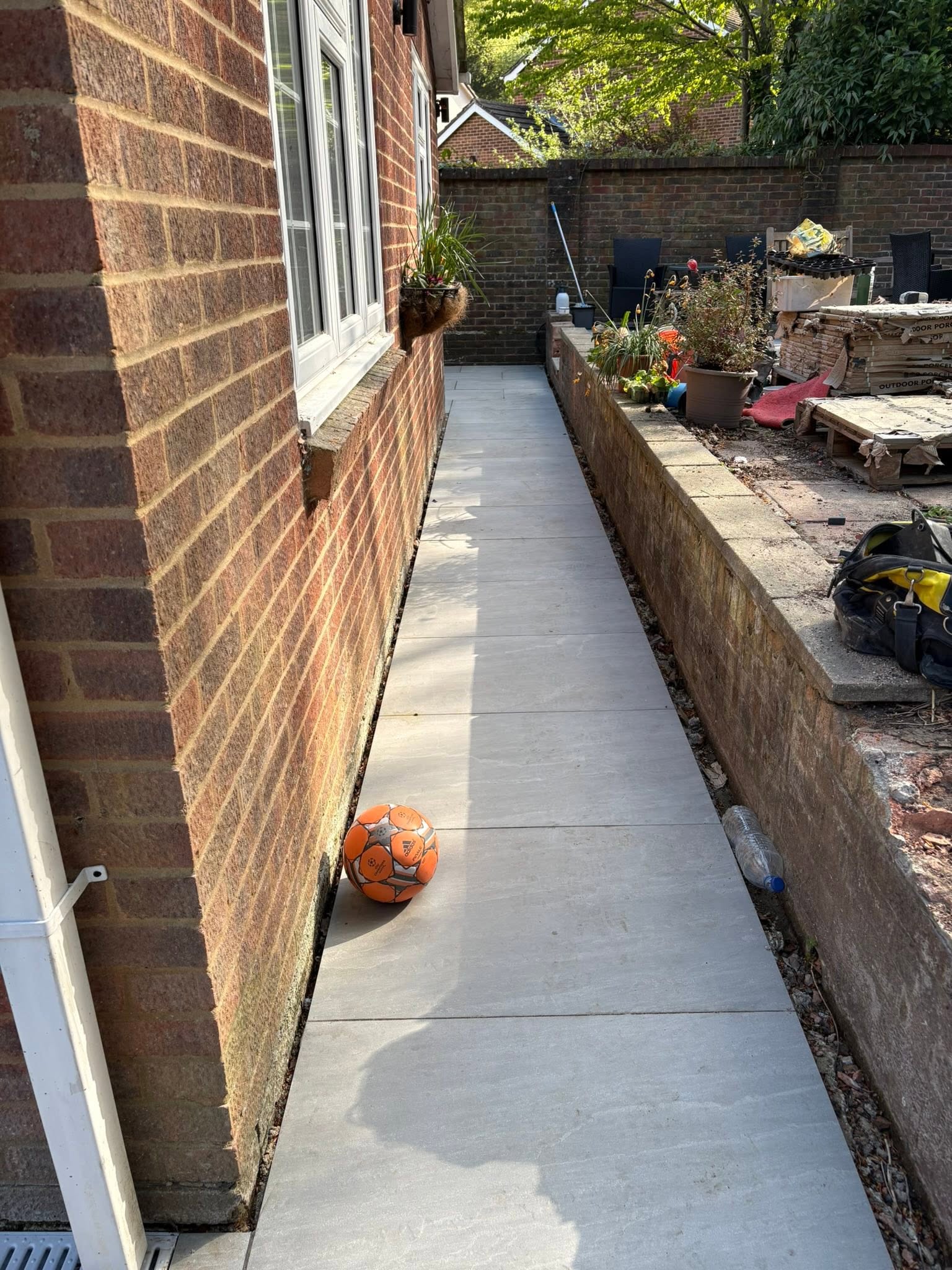 Kandla Grey porcelain side-return path running along the side of a house in Medway