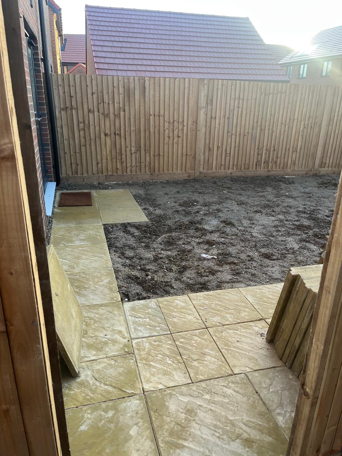 Extended Brett Buff paving patio in Minster garden side view