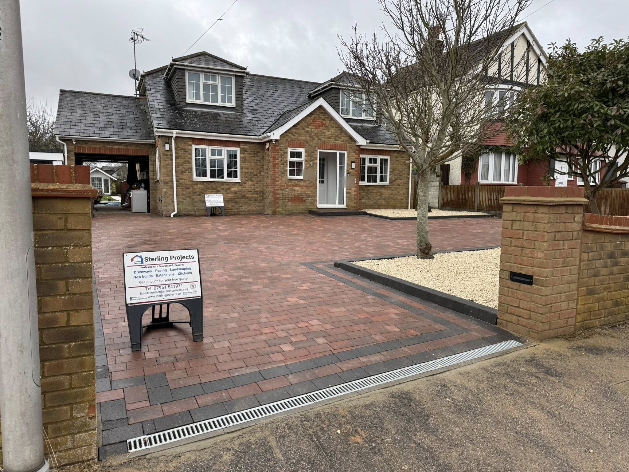 Complete red brick block paving driveway transformation with black border, drainage, steps and tree landscaping Rochester