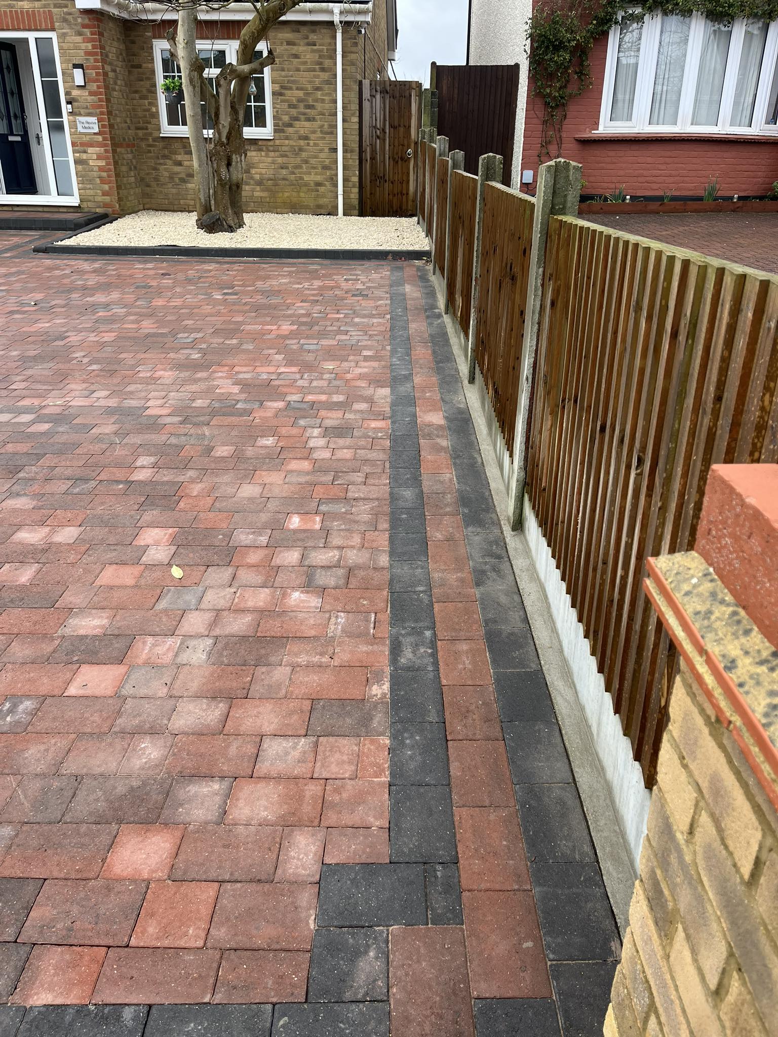 Decorative black border edging for red brick block paving driveway Rochester