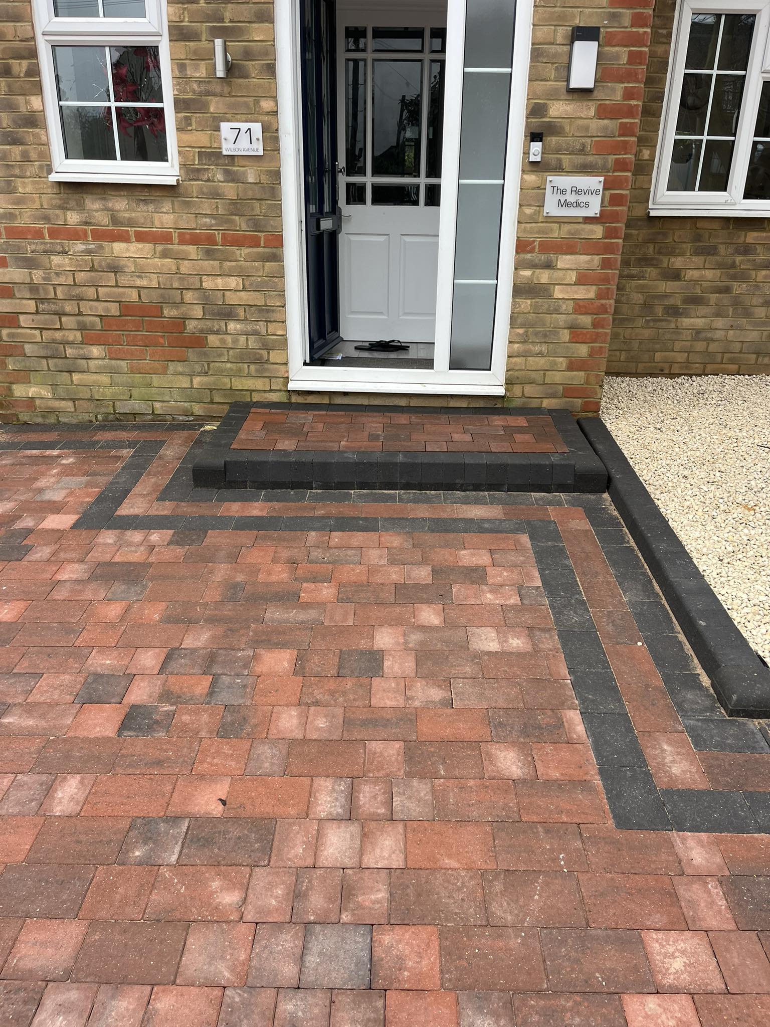 Entrance steps to property from red brick block paving driveway Rochester