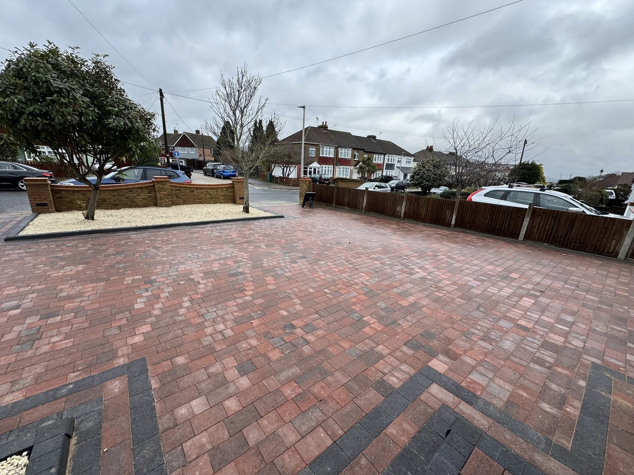 Road view of completed red brick block paving driveway Rochester