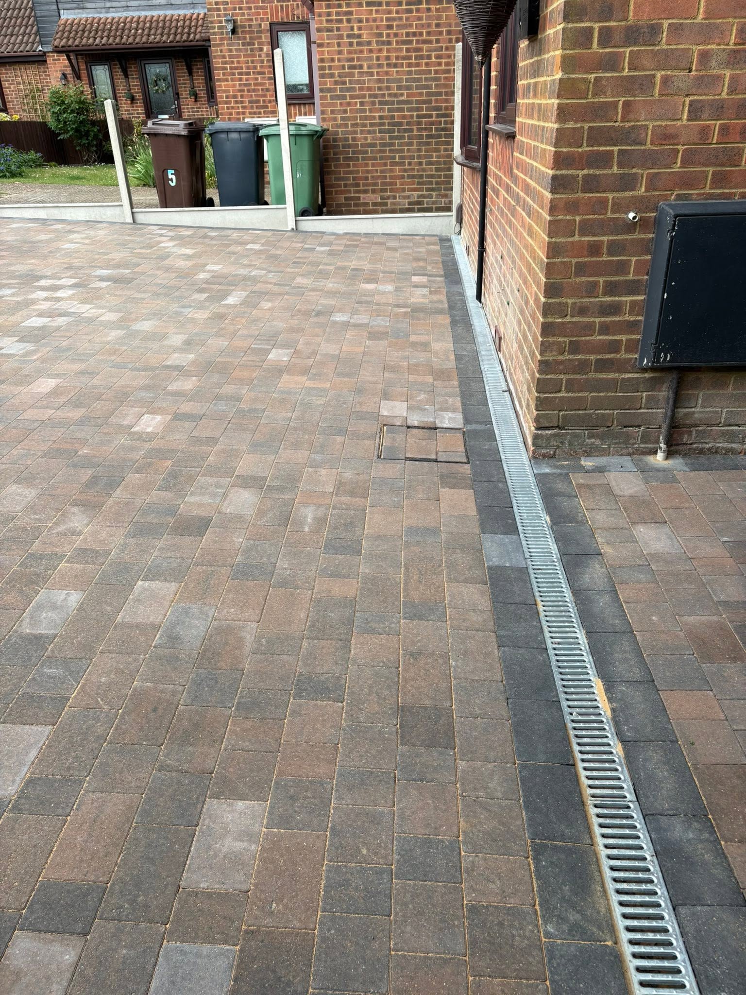 ACO linear drainage channel installed alongside the house on a Brett Trio block paving driveway in Sevenoaks